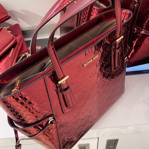 MICHAEL KORS Voyager Lg Metallic Logo Debossed EW Shoulder Tote Bag
Cherry 
NWT - Picture 9 of 16